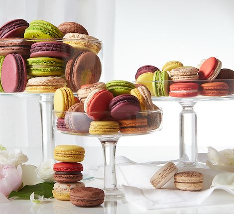 selection of macarons on glass plate Arnaud Larher
